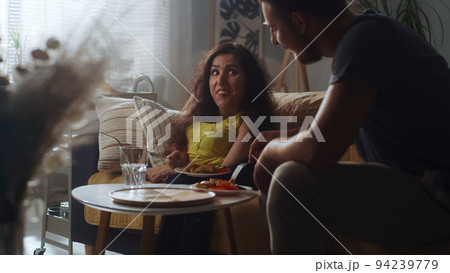 Wife with disability and husband eating Wife with disability and husband eating 94239779