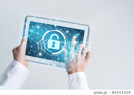 Close of female doctor hands working with tablet pc computer Close of female doctor hands working with tablet pc computer 94241429