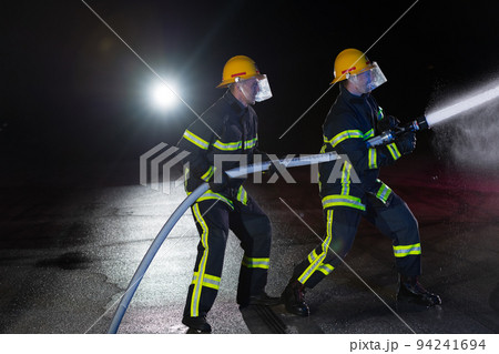 Firefighter with hose - Stock Image - C054/1719 - Science Photo