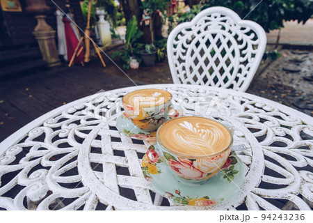 A set of vintage twin hot coffee latte on the table. 94243236