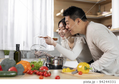 Excited korean family cooking together at home Excited korean family cooking together at home 94244331