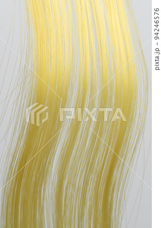 Yellow curly hair strands Yellow curly hair strands 94246576