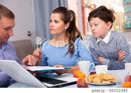 Manager of network marketing company with documents and woman with son 94252385