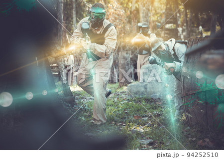 People in full gear playing paintball People in full gear playing paintball 94252510