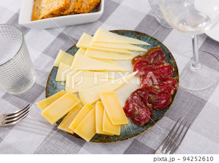 Delicious cold cuts from Spanish sausages and cheeses 94252610