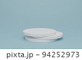 white cylinder podium on light blue background. 94252973