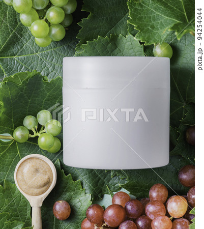 jar of anti-aging cream. Organic cosmetics with grape seed oil and herbal ingredients. Skincare cosmetic jar of anti-aging cream. Organic cosmetics with grape seed oil and herbal ingredients. Skincare cosmetic 94254044