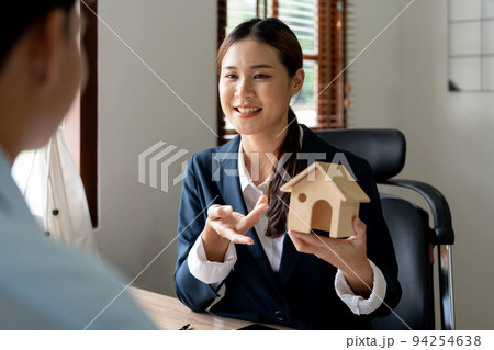 Real estate agent offer house represented by model to client. Real estate agent offer house represented by model to client. 94254638