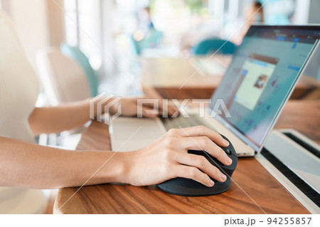 woman hand using computer ergonomic mouse, prevention wrist pain because working long time. De Quervain s tenosynovitis, Intersection Symptom, Carpal Tunnel Syndrome or Office syndrome concept woman hand using computer ergonomic mouse, prevention wrist pain because working long time. De Quervain s tenosynovitis, Intersection Symptom, Carpal Tunnel Syndrome or Office syndrome concept 94255857