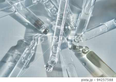There are a lot of pipettes from cosmetics in one photo. 94257588