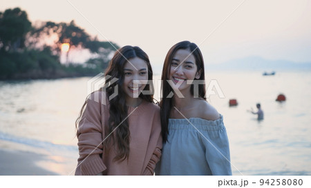 Holiday concept of 4k Resolution. Asian women enjoying the view on the beach together. 94258080