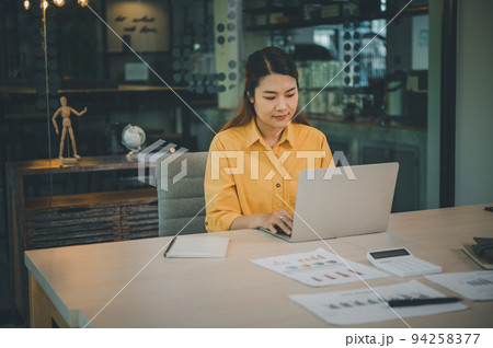 young student wearing headphones studies online, distance learning, and keeps up to date on the global coronavirus pandemic.. young student wearing headphones studies online, distance learning, and keeps up to date on the global coronavirus pandemic.. 94258377