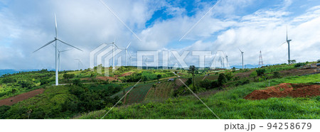 Landscape of Panorama wind turbines on hills with blue sky background. Renewable energy concept Landscape of Panorama wind turbines on hills with blue sky background. Renewable energy concept 94258679