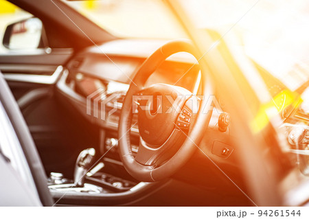 multimedia control panel on the steering wheel of a modern car multimedia control panel on the steering wheel of a modern car 94261544