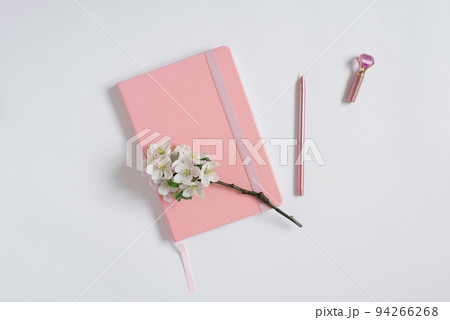 Modern flat lay, hospital, pink notepad or planner with a pen and apple flowers on a white table. Best for social media, blogging Modern flat lay, hospital, pink notepad or planner with a pen and apple flowers on a white table. Best for social media, blogging 94266268