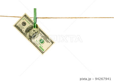 Money laundering. Dollar banknotes hanging on clothesline isolated on white background Money laundering. Dollar banknotes hanging on clothesline isolated on white background 94267941