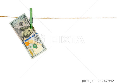 Money laundering. Dollar banknotes hanging on clothesline isolated on white background 94267942