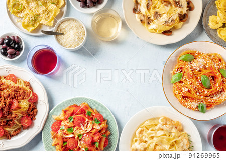Italian pasta dishes forming a frame for copy space, overhead flat lay shot Italian pasta dishes forming a frame for copy space, overhead flat lay shot 94269965