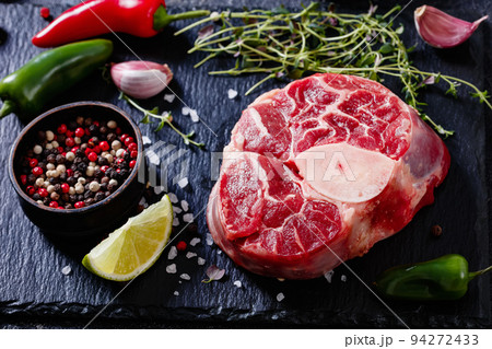 raw osso buco, veal shank steak on stone board raw osso buco, veal shank steak on stone board 94272433