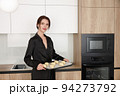 Young beautiful woman preparing croissants in the new modern kitchen 94273792