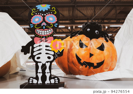 Decorations for Halloween and Day of the Dead in Mexico. Skeleton and fresh pumpkins. Scary decor to celebrate Dia Los Muertos. 94276554