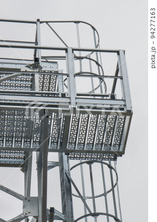 Ladder on silo for storage grain after harvest. Detail of agricultural equipments Ladder on silo for storage grain after harvest. Detail of agricultural equipments 94277163