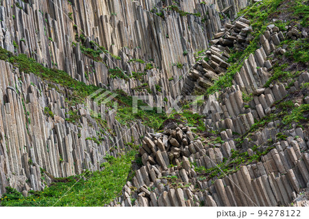 landscape with columnar basalt rocks forming a natural geometric pattern landscape with columnar basalt rocks forming a natural geometric pattern 94278122