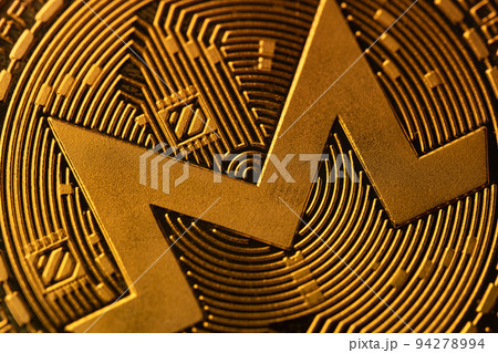 top view extreme macro closeup of crypto Monero golden coin logo top view extreme macro closeup of crypto Monero golden coin logo 94278994