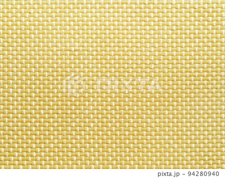 Bulletproof material aramid. Shining aramid kevlar background. Yellow kevlar texture and pattern. Bulletproof material aramid. Shining aramid kevlar background. Yellow kevlar texture and pattern. 94280940