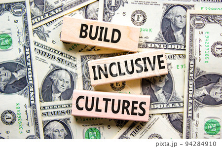 Build inclusive cultures symbol. Concept words Build inclusive cultures on wooden blocks on dollar bills. Beautiful background from dollar bills. Business build inclusive cultures concept. Copy space. Build inclusive cultures symbol. Concept words Build inclusive cultures on wooden blocks on dollar bills. Beautiful background from dollar bills. Business build inclusive cultures concept. Copy space. 94284910