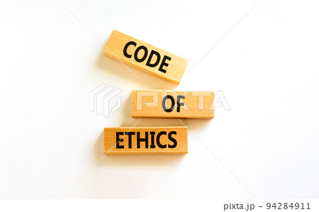 Code of ethics symbol. Concept words Code of ethics on wooden blocks on a beautiful white table white background. Business and code of ethics concept. Copy space. Code of ethics symbol. Concept words Code of ethics on wooden blocks on a beautiful white table white background. Business and code of ethics concept. Copy space. 94284911