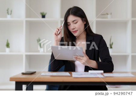 Accountant checking data document on digital tablet for investigation of corruption account Accountant checking data document on digital tablet for investigation of corruption account 94290747