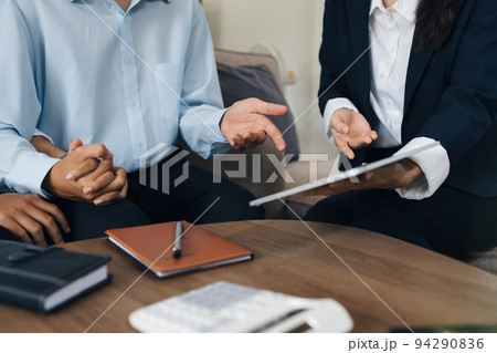 Young couple consultations with a insurance agent. saving and insurance concept Young couple consultations with a insurance agent. saving and insurance concept 94290836