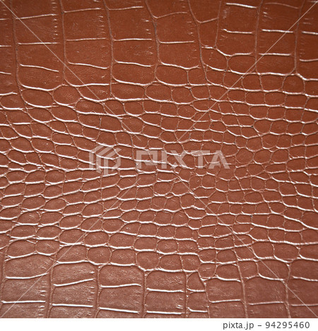 Very luxurious brown crocodile skin square texture used in textile industry 94295460