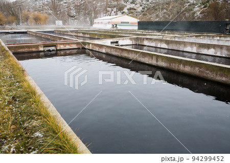 Tanks outdoors of fish farm Tanks outdoors of fish farm 94299452