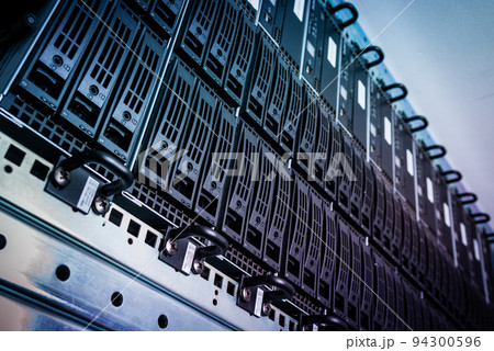 Row of hard disks used for data storage in internet data center Row of hard disks used for data storage in internet data center 94300596