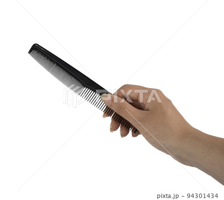 a comb in the female hand a comb in the female hand 94301434