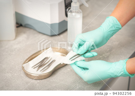 Hand disinfects tweezers with cleaning systems for medical instruments. Ultrasonic cleaner 94302256