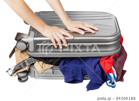 Travel suitcase full of things. Packing a suitcase for a trip. Travel suitcase full of things. Packing a suitcase for a trip. 94306188
