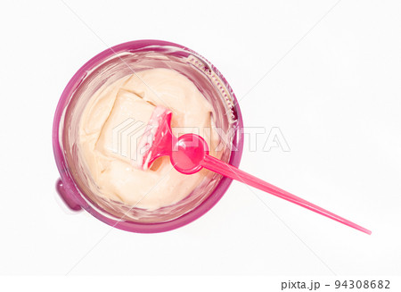 Top view of a bowl with hair dye and brush isolated on white background. Hair coloring Top view of a bowl with hair dye and brush isolated on white background. Hair coloring 94308682
