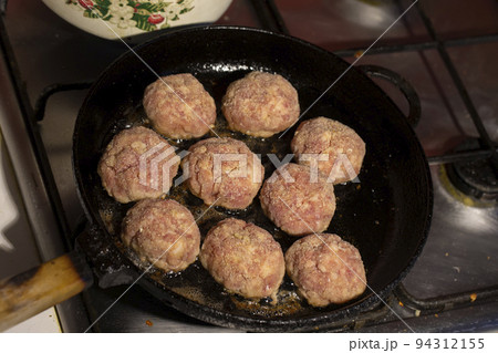Cooking meat cutlets. meatballs are fried in a pan. Cooking meat cutlets. meatballs are fried in a pan. 94312155