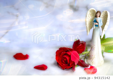 Banner. Cute angel with a bouquet of red roses on a white marble background. The theme of love. valentine's day. A postcard for the holidays. Happy Angel Day. Wedding. Space for text. Copy space Banner. Cute angel with a bouquet of red roses on a white marble background. The theme of love. valentine's day. A postcard for the holidays. Happy Angel Day. Wedding. Space for text. Copy space 94315142