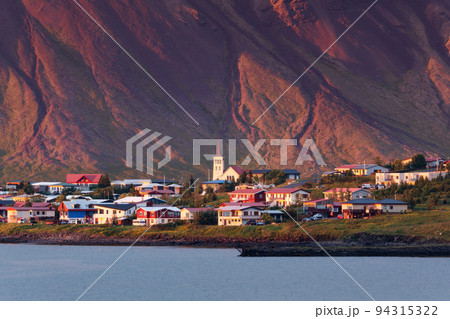 Sunset glowing on Icelandic village by coastline in Snaefellsnes Peninsula on summer at Iceland 94315322