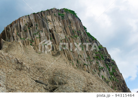 amazing landscape of columnar volcanic basalt rocks on the island of Kunashir amazing landscape of columnar volcanic basalt rocks on the island of Kunashir 94315464