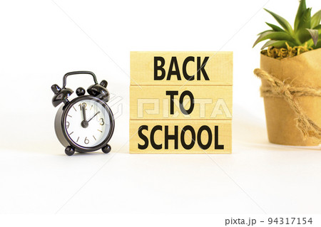 Back to school and support symbol. Concept words Back to school on wooden blocks. Black alarm clock. Beautiful white table white background. Business, educational Back to school concept. Copy space. Back to school and support symbol. Concept words Back to school on wooden blocks. Black alarm clock. Beautiful white table white background. Business, educational Back to school concept. Copy space. 94317154