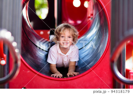 Child on playground. Kids play outdoor. 94318179