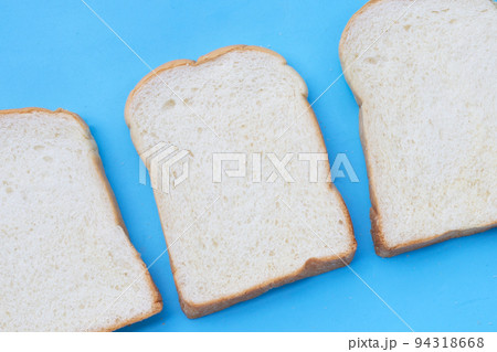 Sliced bread on blue background. Sliced bread on blue background. 94318668