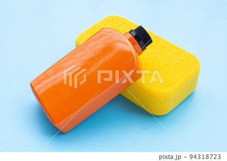 Car wash and wax bottle with yellow sponge Car wash and wax bottle with yellow sponge 94318723