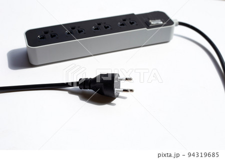 Electrical power strip and plug on white background. Electrical power strip and plug on white background. 94319685