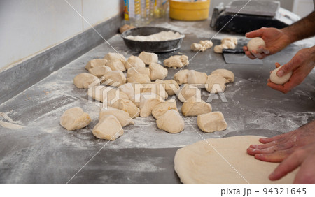 Baker shaping dough 94321645